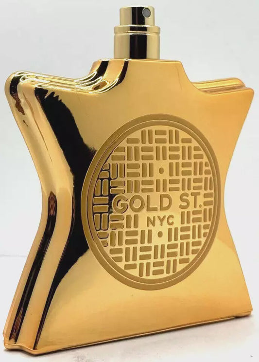 Bottle of Bond No. 9 Gold Street unisex Eau de Parfum displayed with gold accents and elegant packaging.